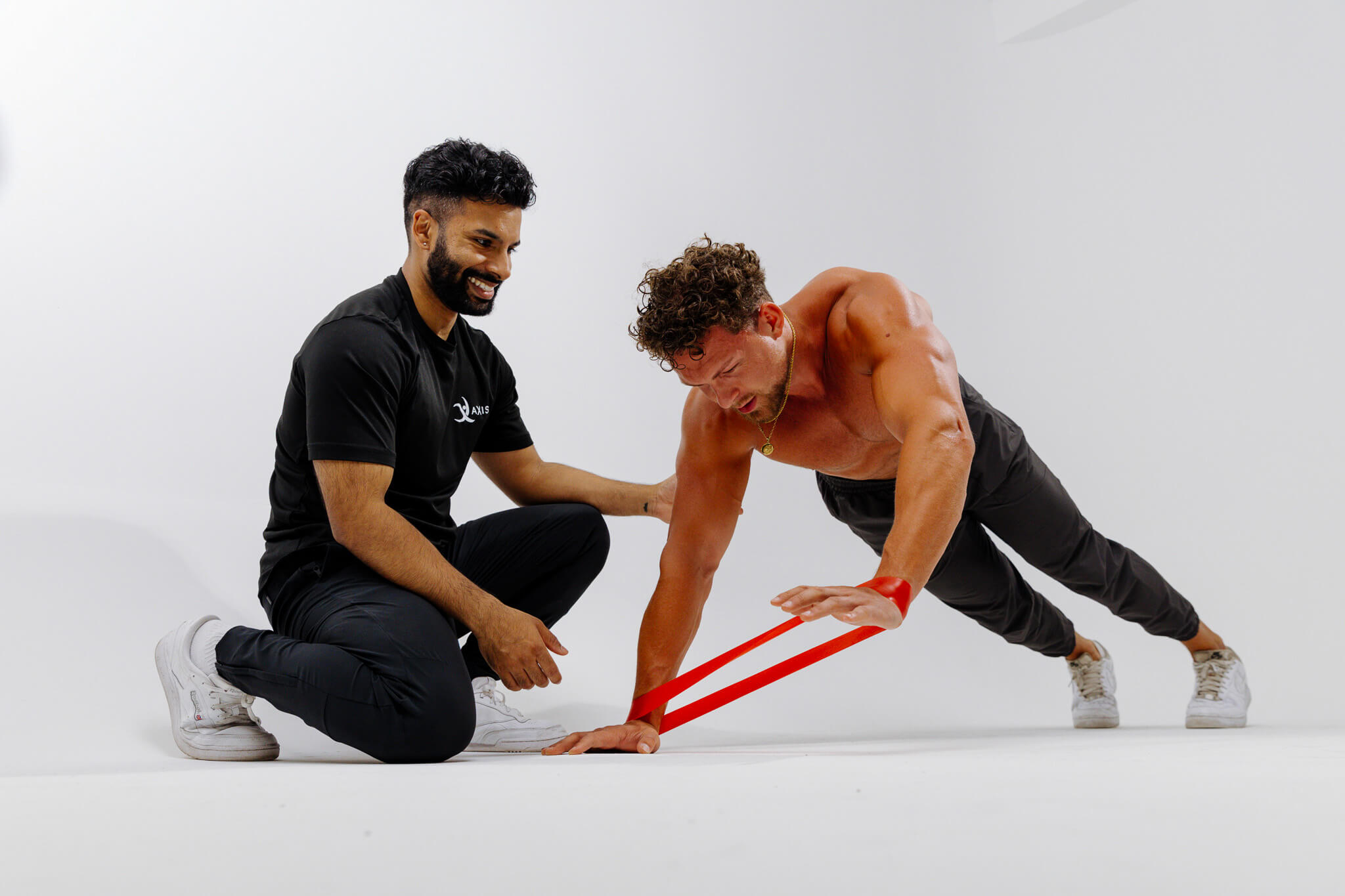 Performance coach assisting an athlete with training exercises